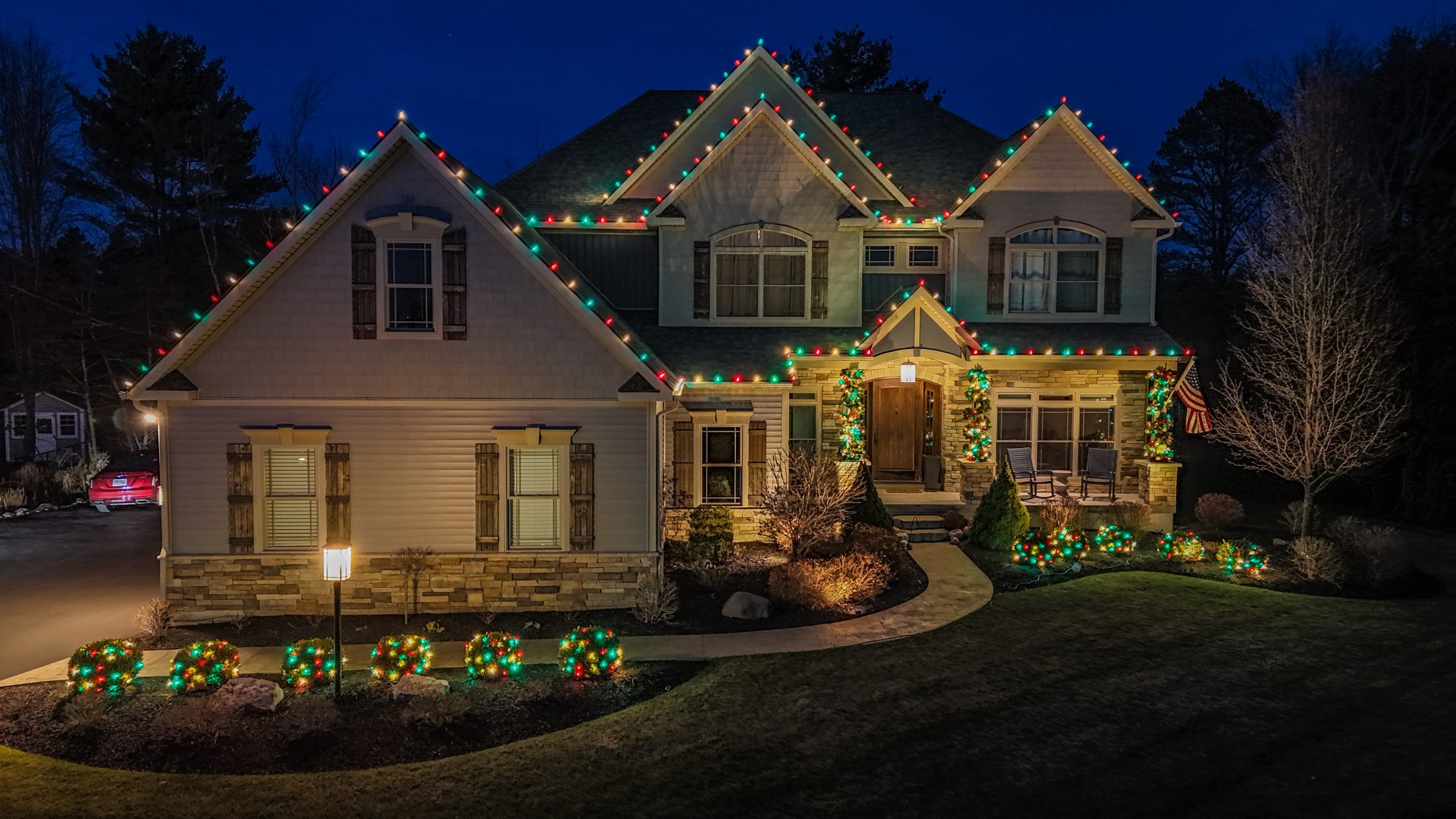 Warm white holiday lighting installation — full house and landscape